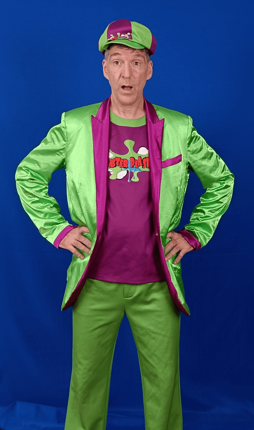 Todd Plaster wearing his approved green suit, purple lapels and green-and-purple cap