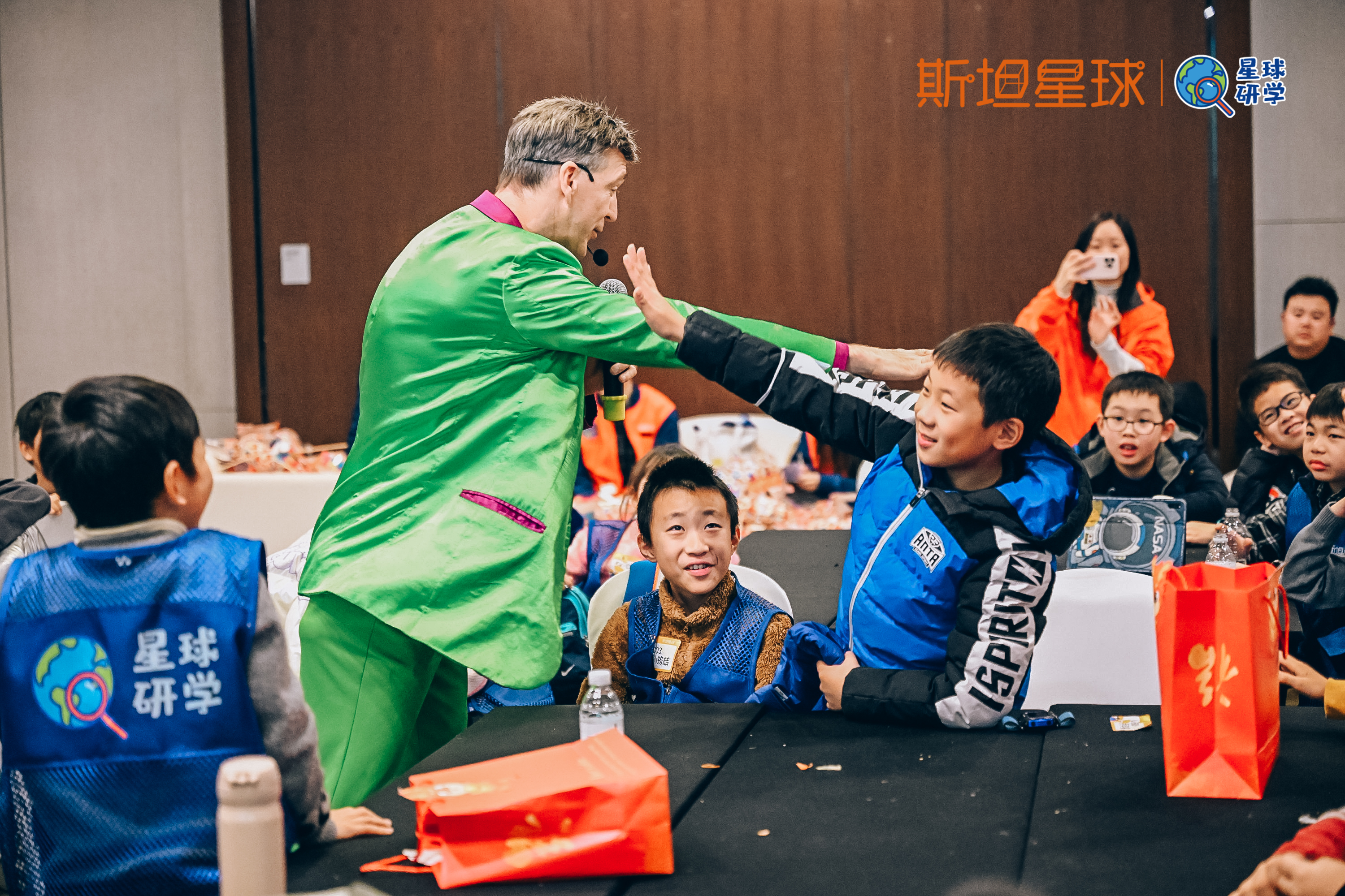 Master Plaster performing an interactive magic trick with students